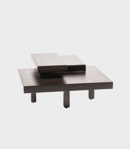 Modern coffee table with a dark finish and square elevated sections, suitable for living rooms and decor.