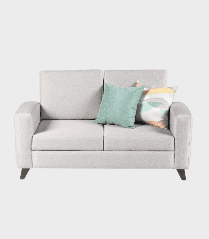 Sofá gris con cojines decorativos en tonos pastel, ideal para salas de estar modernas y elegantes en zonas de muebles y decoración.