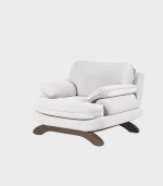 Suelo de madera oscura, sillón de respaldo alto, cojines de asiento y respaldo blancos, estilo moderno, ideal para sala de estar.