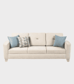 Sofá beige con cojines azules y patrón, ideal para decoración de interiores, zona de muebles y sillones confortables para el hogar o oficina.