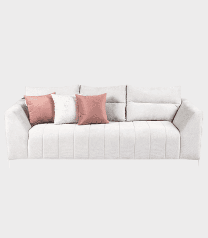 Sofá moderno con cojines en tonos rosa y blanco, ideal para salones y áreas de descanso en hogares sofisticados.
