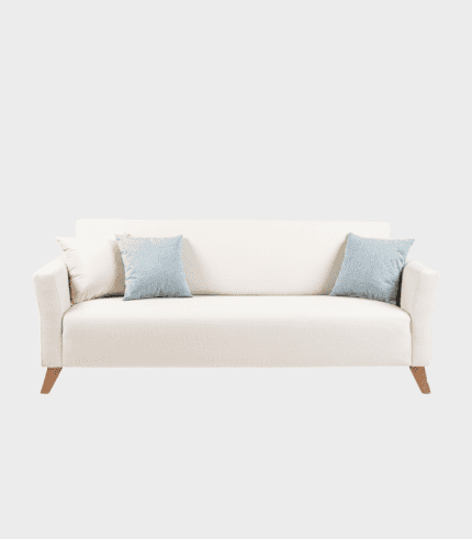 Sofá blanco con cojines azules, ideal para decorar y promover el confort en sala de estar. Diseño moderno y elegante para enriquecer cualquier ambiente del hogar o oficina.