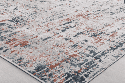 Alto: Alfombra decorativa con diseño abstracto en tonos coral, gris y blanco, perfecta para sala u oficina.