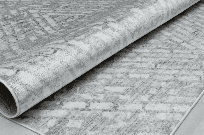 Blanco y gris alfombra de estilo moderno con textura suave y diseño elegante, ideal para decorar y dar confort a cualquier espacio.