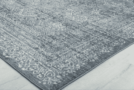 Suelo de alfombra gris con diseño clásico, ideal para decorar espacios elegantes y acogedores.