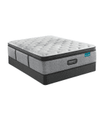 Alta: Colchón de espuma viscoelástica con tapizado en gris y detalles en negro, ideal para dormitorios elegantes y cómodos.