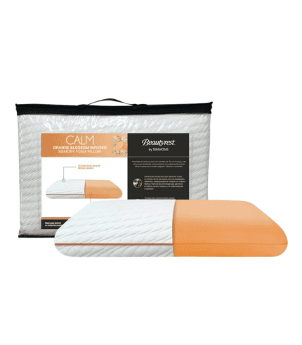 Almohada de memoria con infusión de flor de azahar y colores naranjas, ideal para descansar y decorar dormitorios modernos o clásicos.