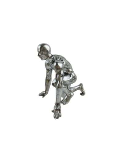 Relieves of a metallic humanoid sculpture in a crawling position.